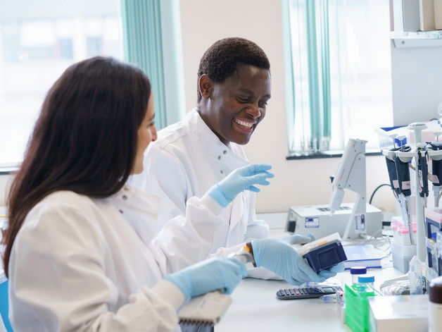 two scientists at the bench