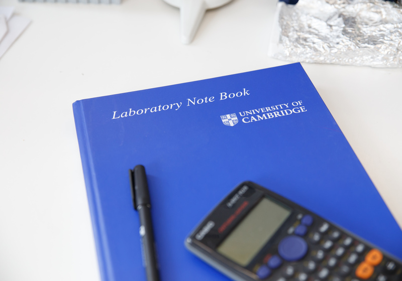 Lab notebook and calculator
